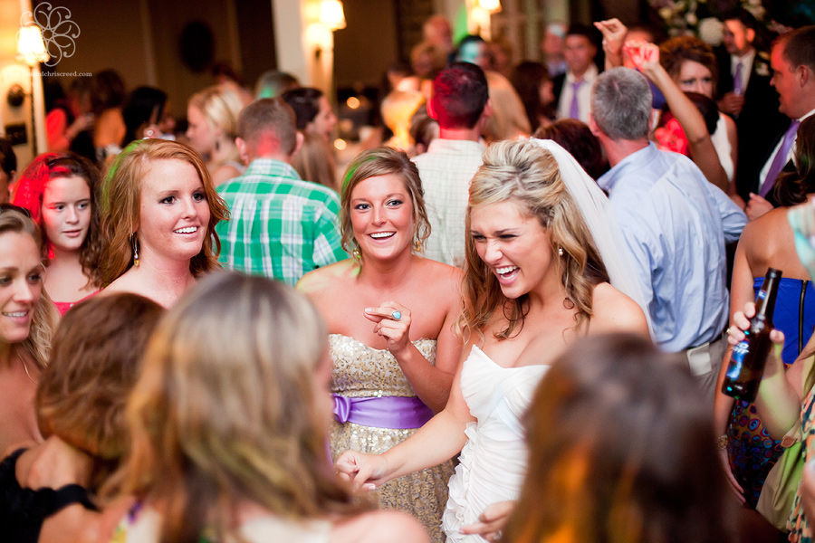 A bride dances with wedding guests at Winchester Country Club