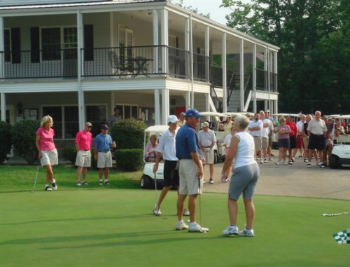 Guests gather around the practice area for an event at Winchester Country Club