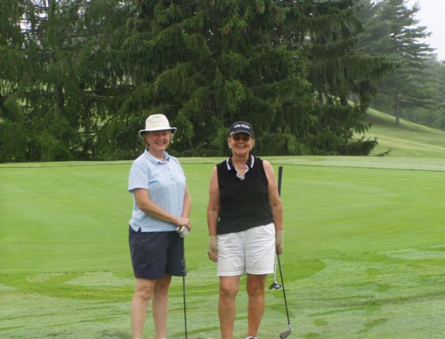 Two women pose for a picture on the course at Winchester Country Club